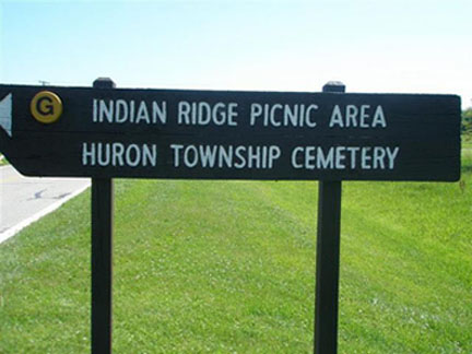 Sign Showing The Direction To Cemetery